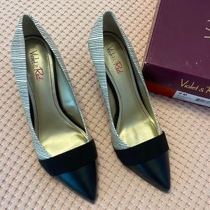 Like new black and white pumps